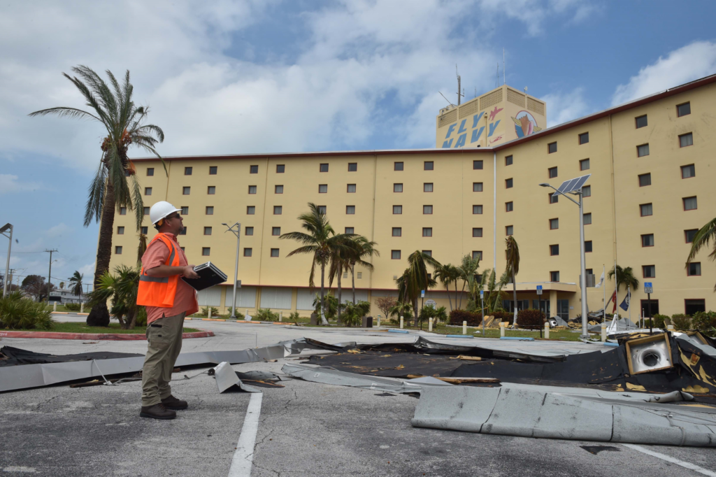 NAVFAC engineer Robert Long, from Omaha, Nebraska, surveys damage at NAS Key West after Hurricane Irma.
