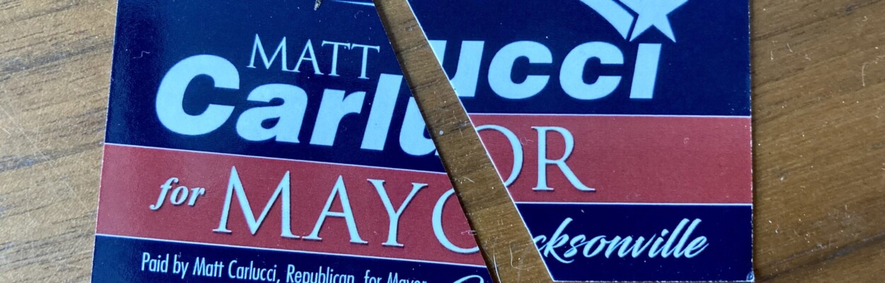 Carlucci for mayor card cut in half