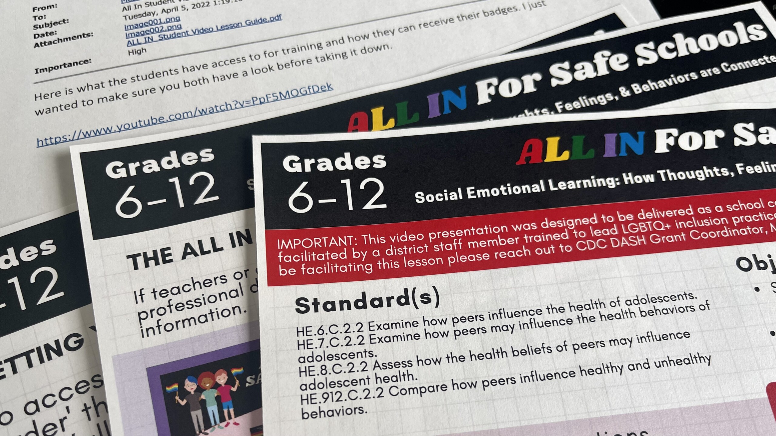 A stack of papers, including a Duval Schools email about removing an anti-bullying video teaching students how to support LGBTQ+ peers