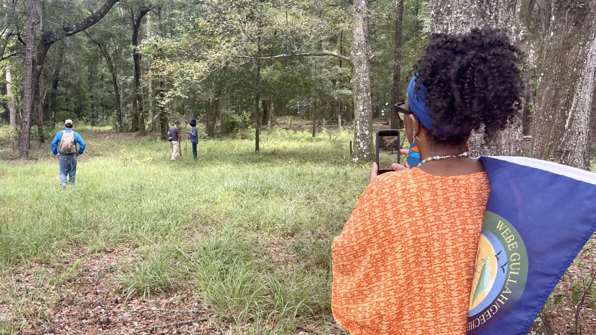 Gullah/Geechee Nation representative Glenda Simmons-Jenkins (right), a group of archaeologists and Nassau County and Rayonier representatives visit a Gullah/Geechee cemetery on proposed Wildlight development land. | Claire Heddles, Jacksonville Today