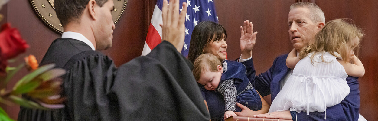Florida Supreme Court Justice John D. Couriel, administers the oath of office for Speaker of the Florida House of Representatives to Paul Renner, R-Palm Coast, shown with his wife Adriana and their children, William Andrew and Abigal, in the House chamber during Organization Session of the Legislature, November 22, 2022.