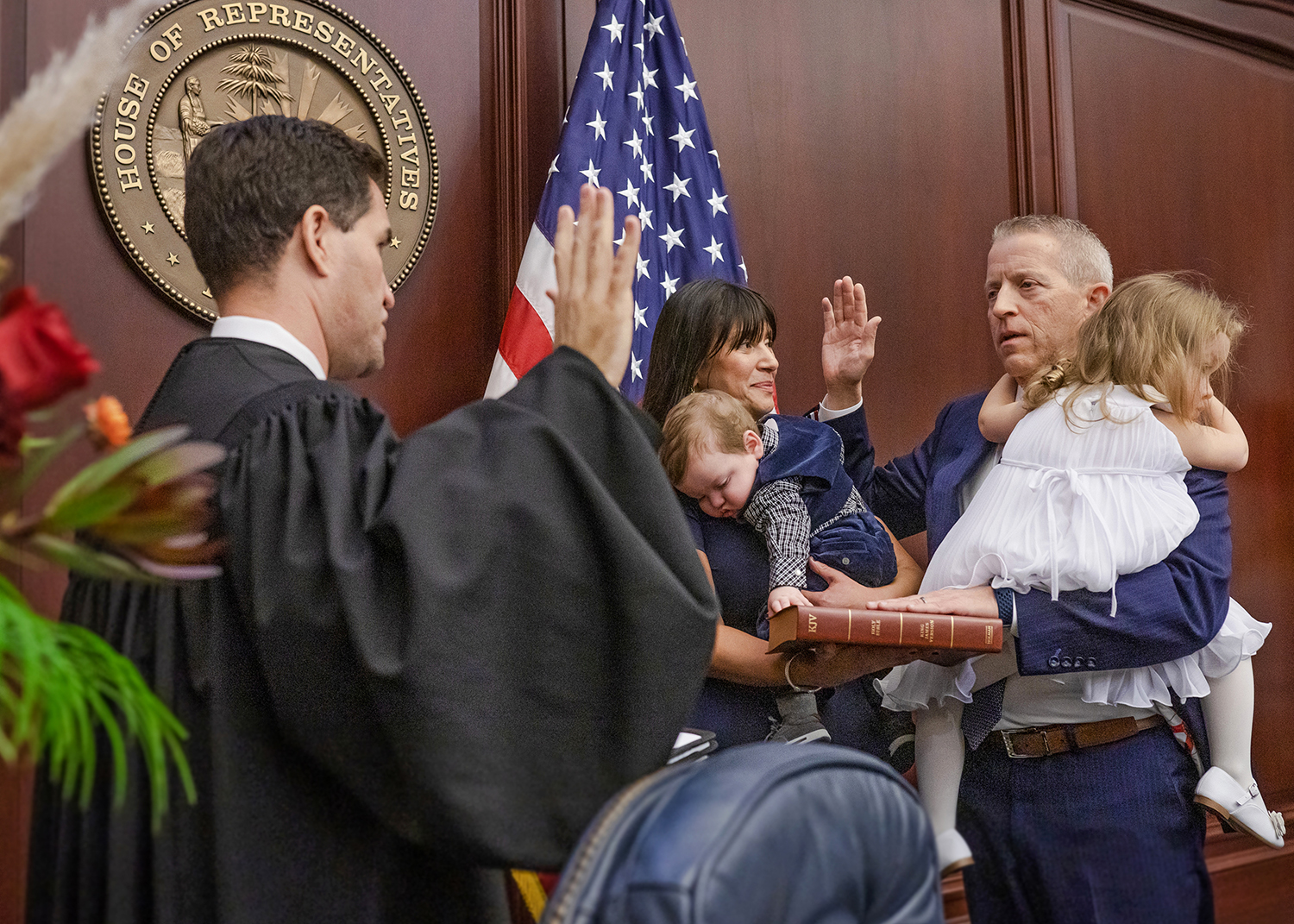 Florida Supreme Court Justice John D. Couriel, administers the oath of office for Speaker of the Florida House of Representatives to Paul Renner, R-Palm Coast, shown with his wife Adriana and their children, William Andrew and Abigal, in the House chamber during Organization Session of the Legislature, November 22, 2022.