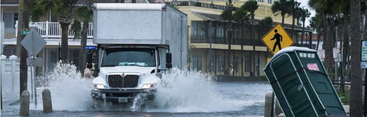A truck plows through floodwaters in St. Augustine.