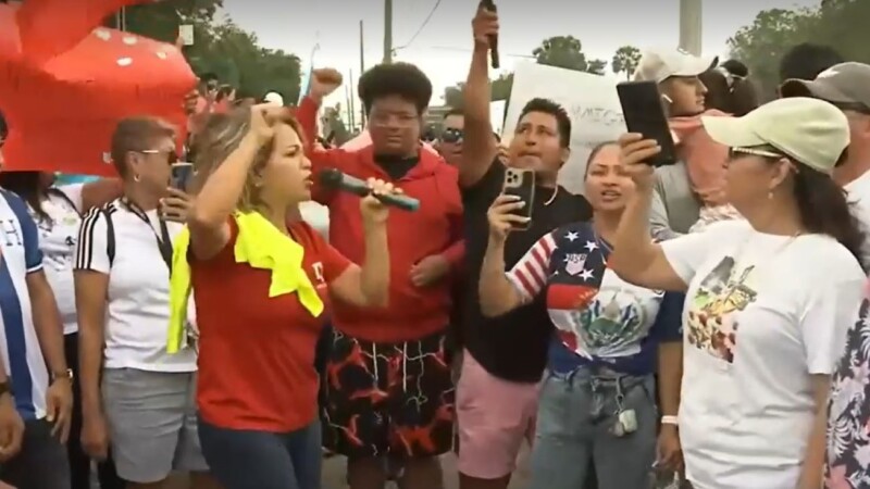 Featured image for “100 people line Jacksonville street to protest immigration law”