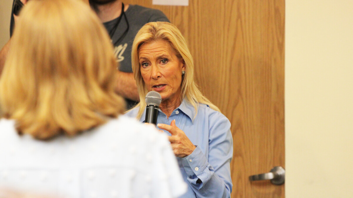 Mayor Donna Deegan speaks to Cindy Funkhouser, CEO of the Sulzbacher Center, at a town hall this week. Funkhouser, who sits on the mayor's committee on homelessness, urged the mayor to help make a solid plan to tackle affordable housing and homelessness across the county.