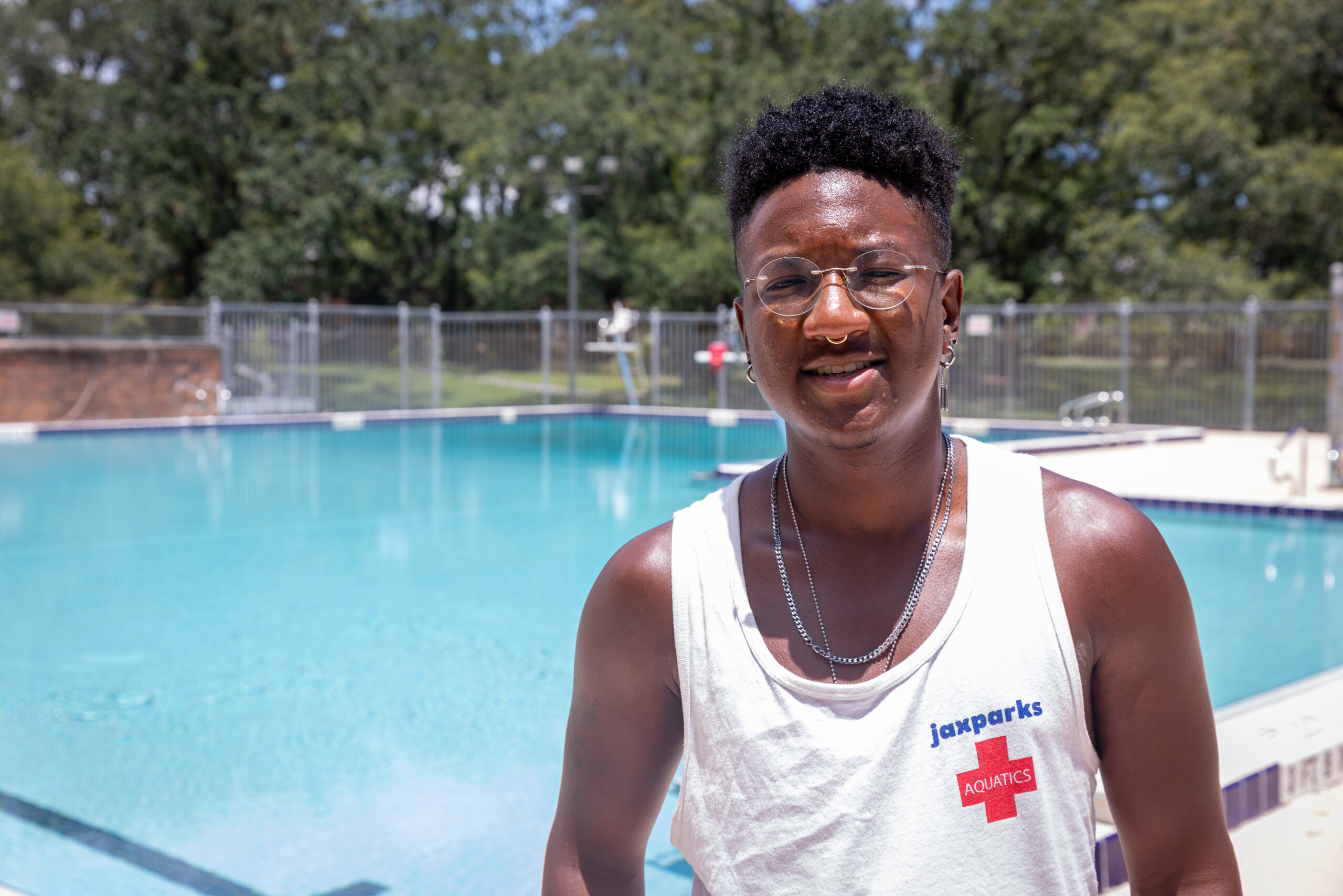 Zay Tucker is a lifeguard at the Emmett Reed Community Pool in Brentwood. He stopped for a photo minutes before the pool opened for the summer in July 2023. Tucker has served as a lifeguard for five years. "I know a lot of people. I like seeing people I know and friends that live over here. It's cool," Tucker said. | Will Brown, Jacksonville Today