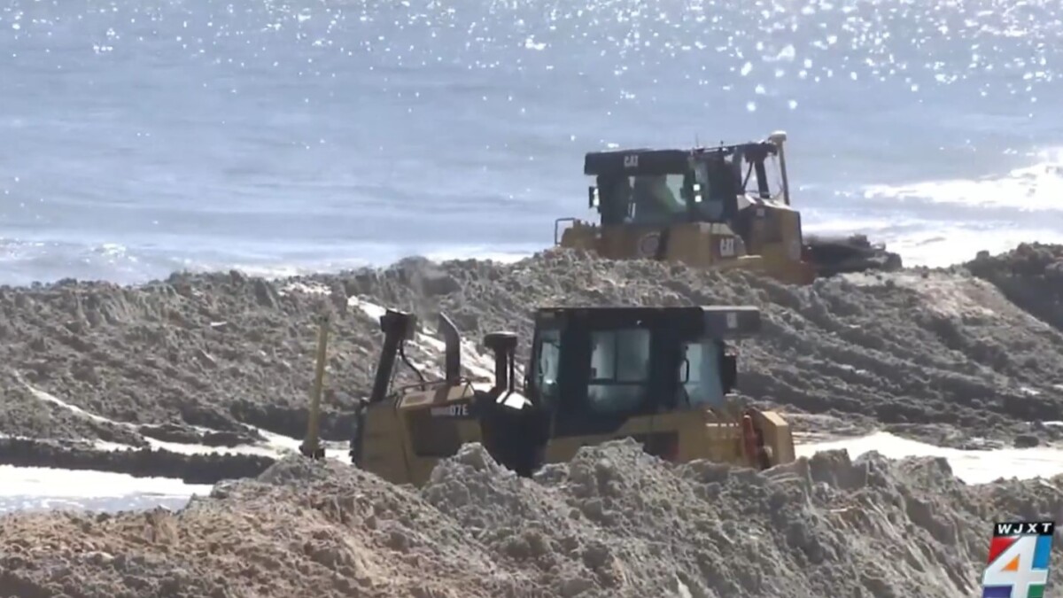 Bulldozers build up part of Vilano Beach during a renourishment project in 2021. | News4Jax