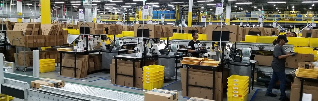 Employees work inside the city’s first Amazon fulfillment center near Jacksonville International Airport.