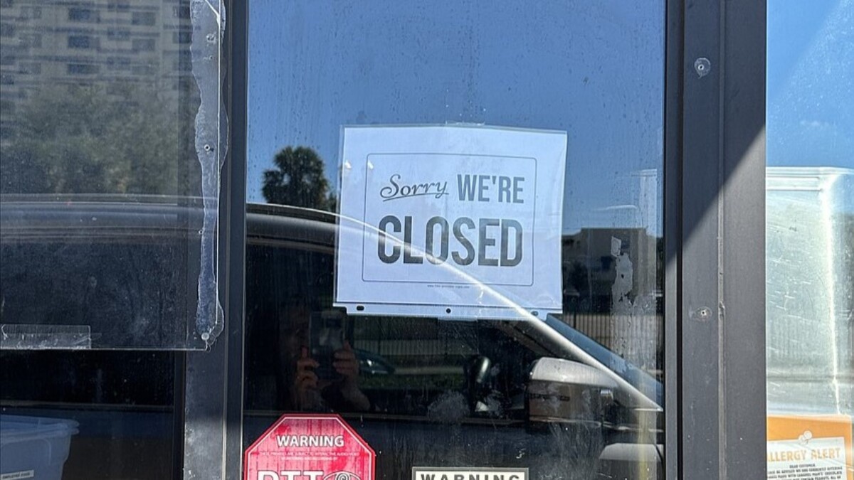 A sign on Burger's King's drive-thru window says the restaurant is closed. | Karen Brune Mathis, Jacksonville Daily Record