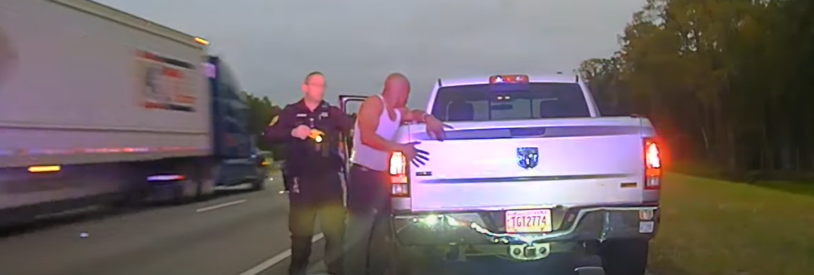 Leonard Cure places his hands on the back of his truck as Sgt. Buck Aldridge prepares to fire his Taser during a traffic stop Oct. 16, 2023, in Camden County, Georgia. | Camden County Sheriff's Office