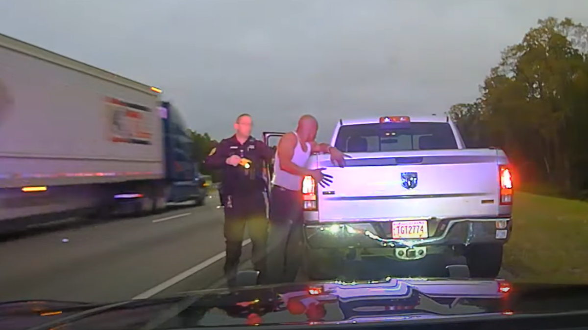 Leonard Cure places his hands on the back of his truck as Sgt. Buck Aldridge prepares to fire his Taser during a traffic stop Oct. 16, 2023, in Camden County, Georgia. | Camden County Sheriff's Office