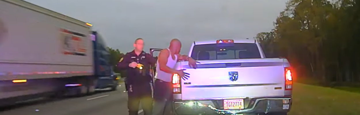 Leonard Cure places his hands on the back of his truck as Sgt. Buck Aldridge prepares to fire his Taser during a traffic stop Oct. 16, 2023, in Camden County, Georgia. | Camden County Sheriff's Office