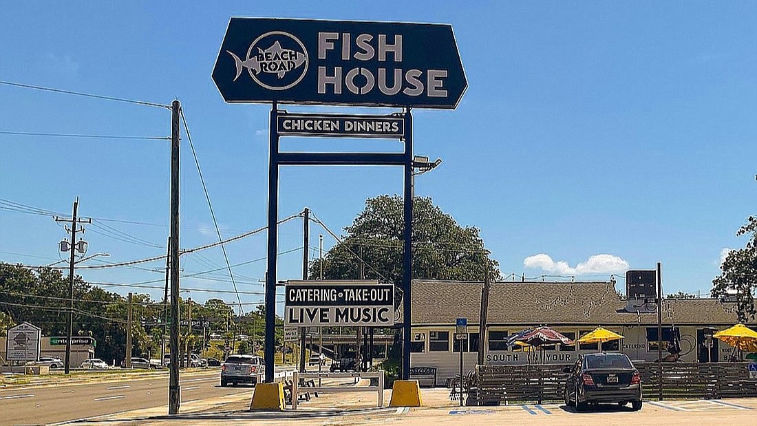 The Beach Road Fish House sign is for sale.