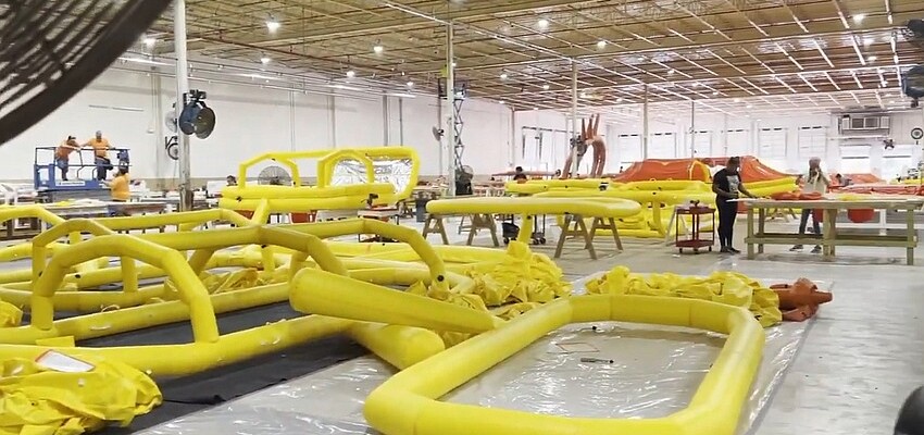 Survival life rafts are shown under construction in this image from a Wing Group video about its North Jacksonville plant.
