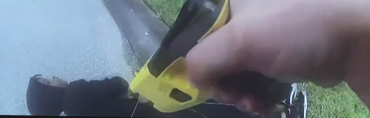 An image from a police bodycam shows Le'Keian Woods on the ground after an officer hit him with two Taser shots.