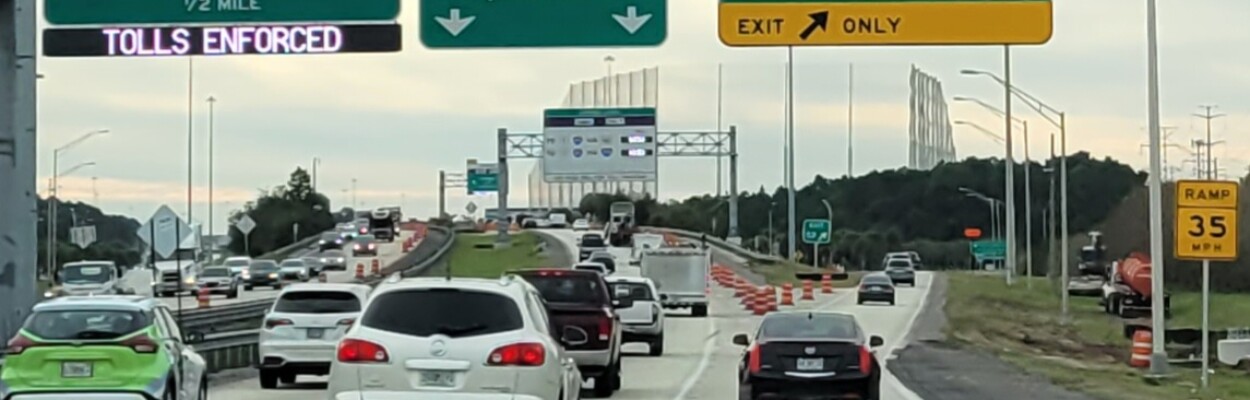 Barrels line the Town Center Parkway exit off I-295, part of a widening project by the Florida Department of Transportation. | Dan Scanlan, WJCT News 89.9