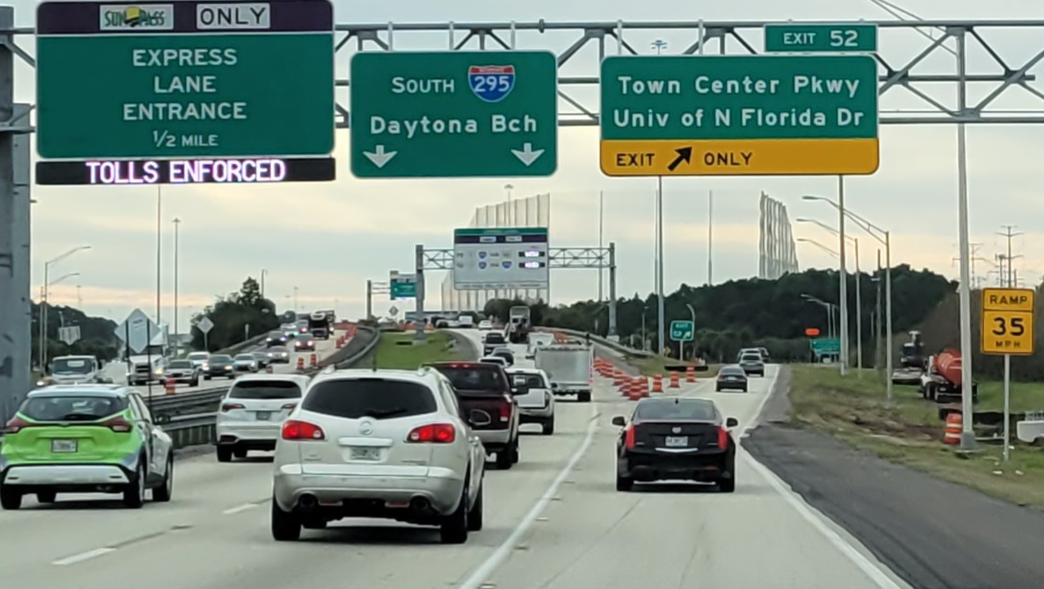 Barrels line the Town Center Parkway exit off I-295, part of a widening project by the Florida Department of Transportation. | Dan Scanlan, WJCT News 89.9