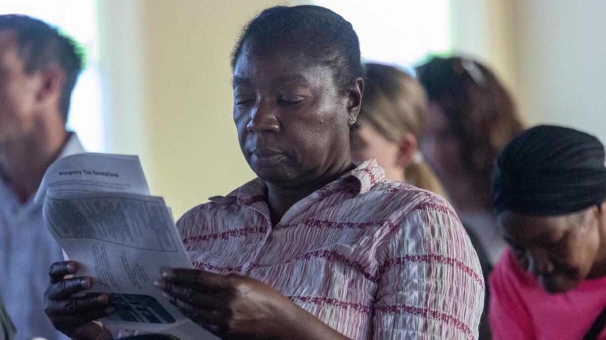 Phyllis Brown reviews information about the North Riverside CDC Home Repair program during a community meeting April 20, 2023. Brown has lived in North Riverside for decades. | Will Brown, Jacksonville Today