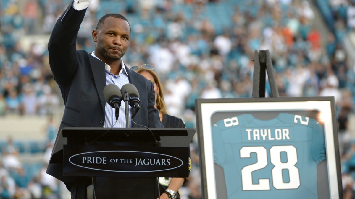 Former Jacksonville Jaguars running back Fred Taylor acknowledges the crowd as he is inducted into the Pride of the Jaguars on Sept. 30, 2012. | Phelan M. Ebenhack, AP