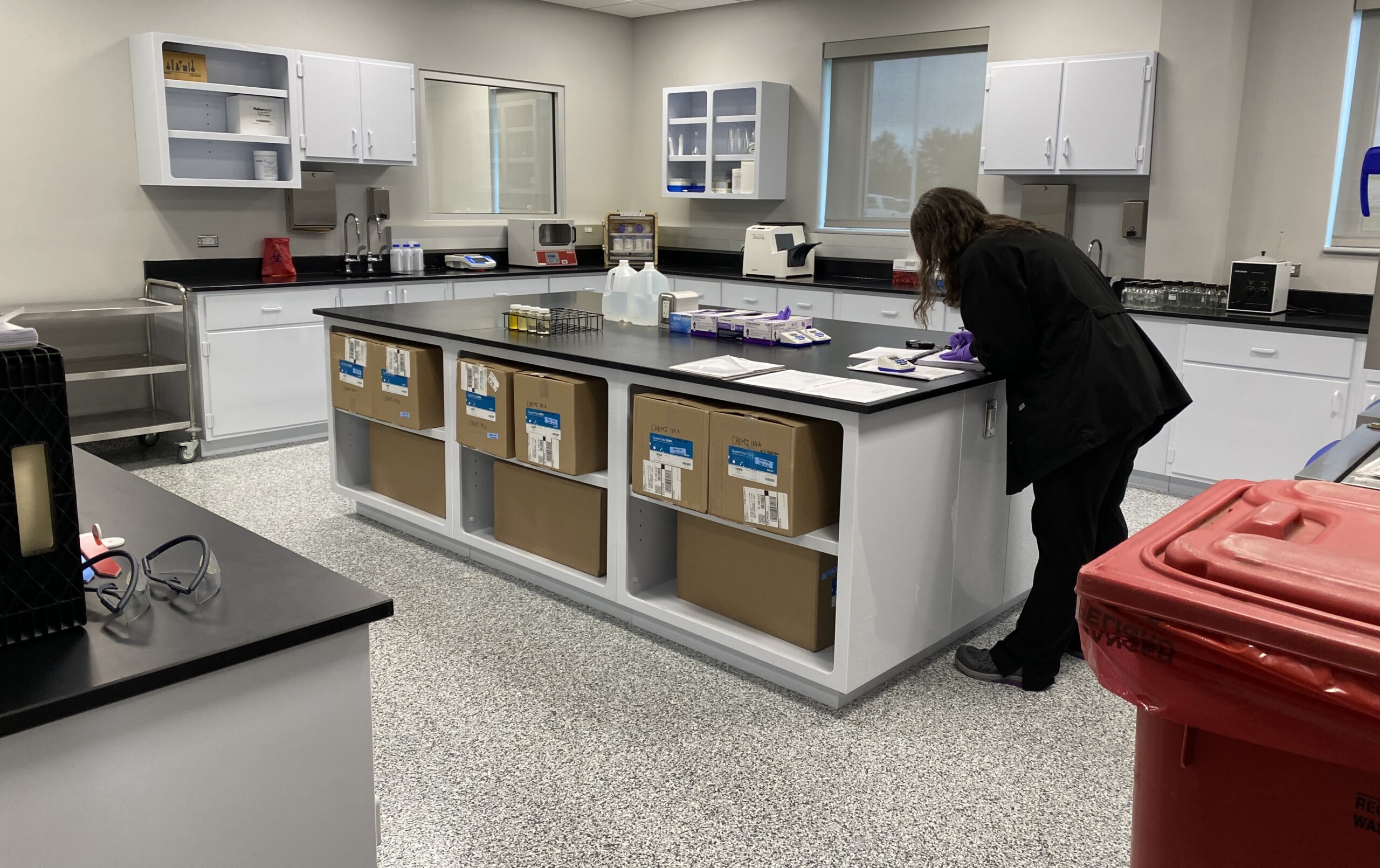 A lab worker reads samples taken at the new utility lab in St. Johns County l Steven Ponson, WJCT News 89.9