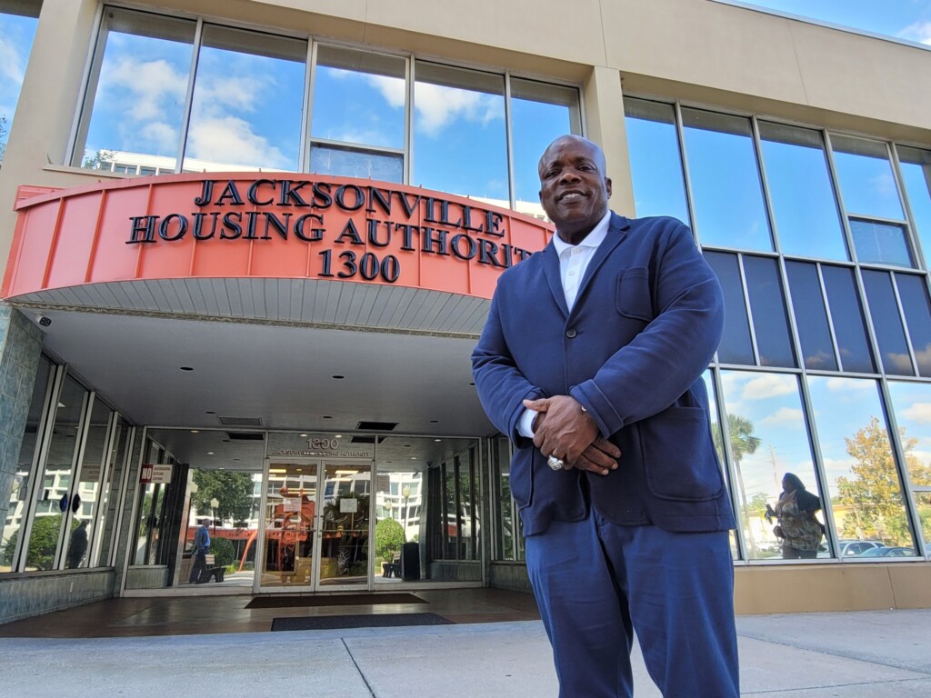 Dwayne Alexander stands outside the entrance to the Jacksonville Housing Authority, where he serves as president and CEO. | Jacksonville Today, Casmira Harrison
