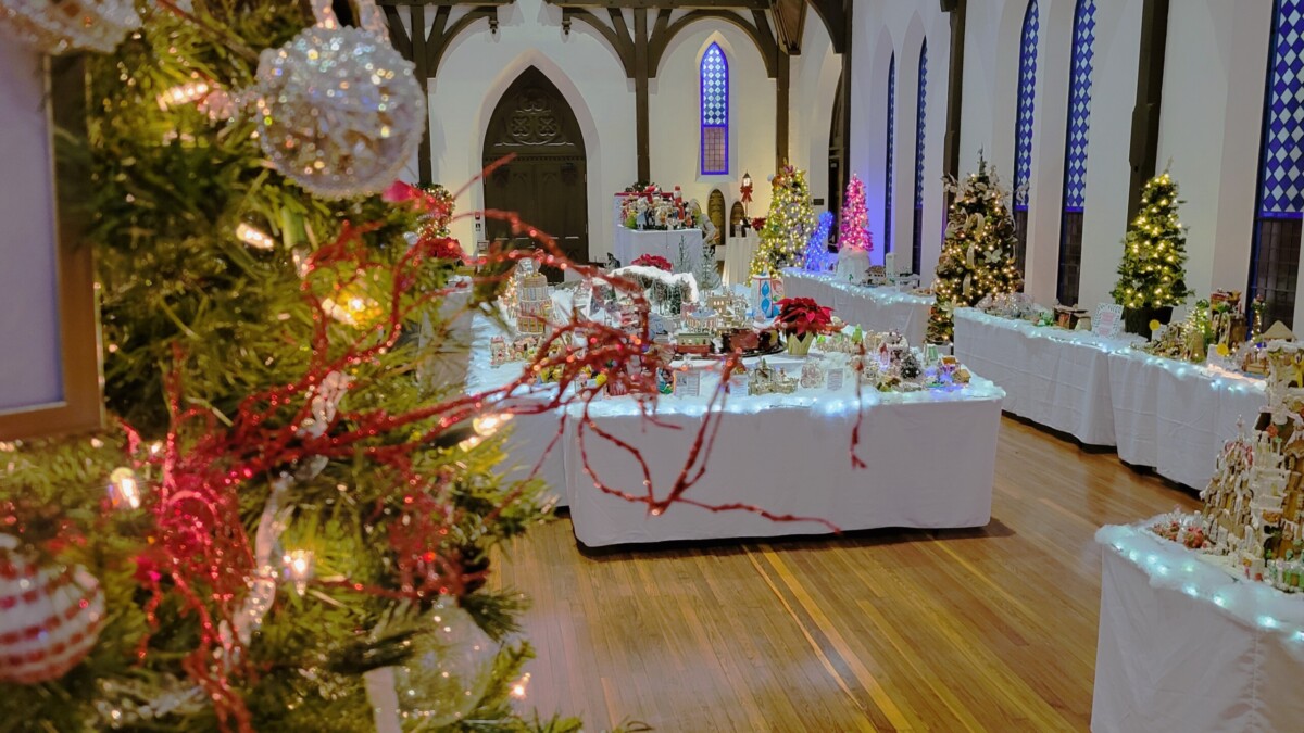 Christmas trees frame the inside the historic sanctuary of Old St. Andrews Church for the 21st annual Gingerbread Extravaganza. | Dan Scanlan, WJCT News 89.9