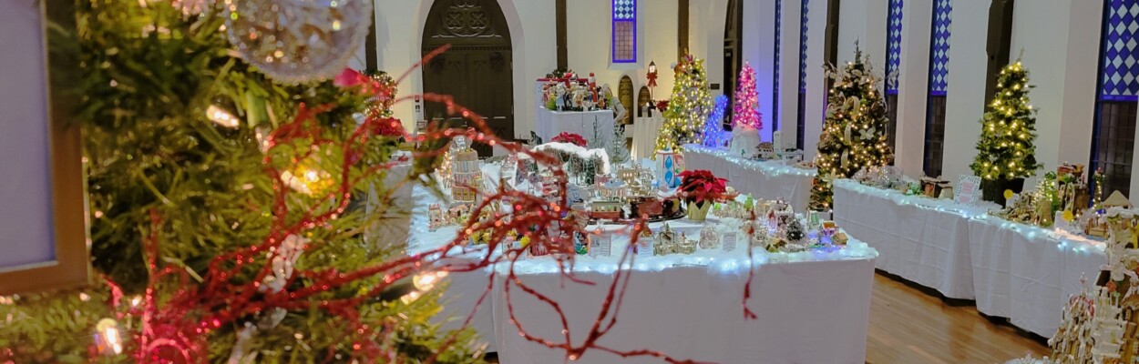 Christmas trees frame the inside the historic sanctuary of Old St. Andrews Church for the 21st annual Gingerbread Extravaganza. | Dan Scanlan, WJCT News 89.9