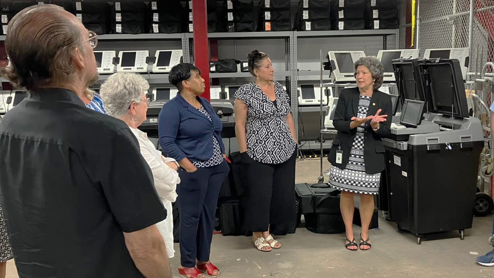 St. Johns County Supervisor of Elections Vicky Oakes, right, speaks to staff in 2022. | St. Johns County Supervisor of Elections