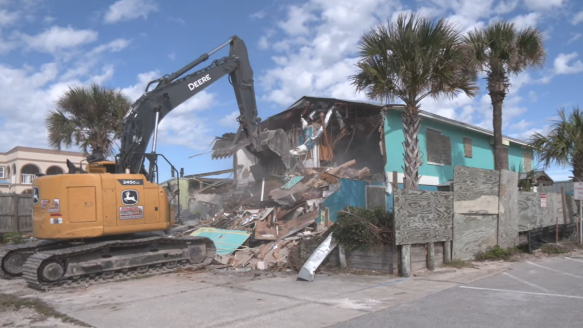 Crews are demolishing the old South Beach Grill restaurant in Crescent Beach to make way for a new beach walkover and parking.