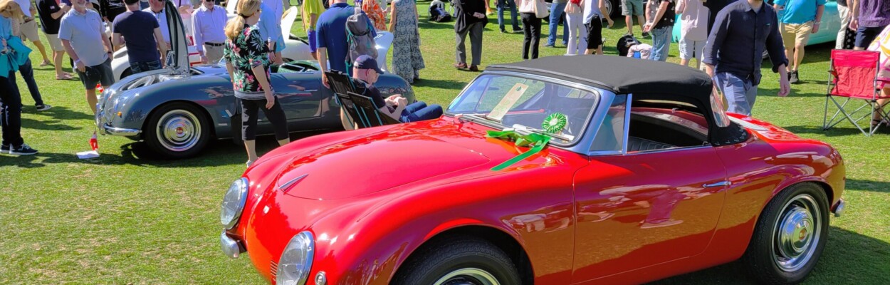 Some of the thousands of fans who flocked to The Amelia concours d'Elegance check out a row of rare Denzel sports cars built in Austria. | Dan Scanlan, WJCT News 89.9