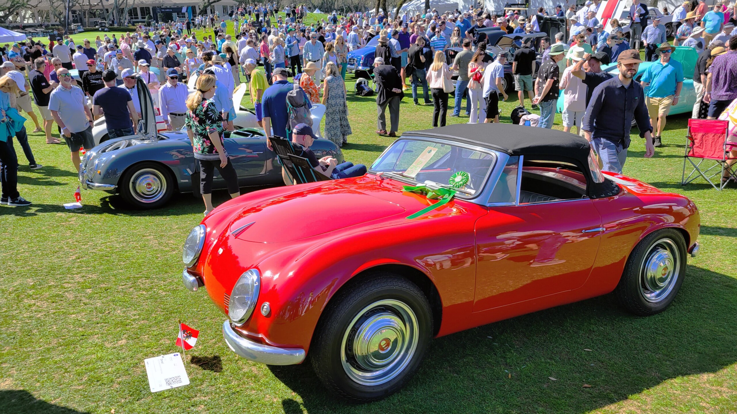 Some of the thousands of fans who flocked to The Amelia concours d'Elegance check out a row of rare Denzel sports cars built in Austria. | Dan Scanlan, WJCT News 89.9