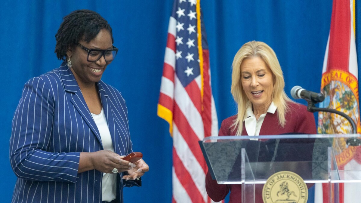 Mayor Donna Deegan presents 904Ward Director of Equity Regina Newkirk Rucci a resolution celebrating Black History Month. Deegan announced the creation of an African American Advisory Board on Tuesday, Feb. 27, 2024, at City Hall. | Will Brown, Jacksonville Today