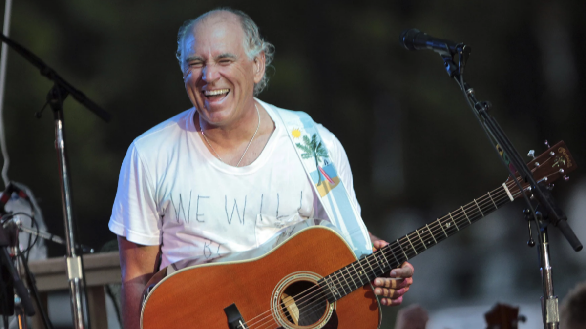 Jimmy Buffett performs in Gulf Shores, Alabama, on June 30, 2010. | Dave Martin, AP
