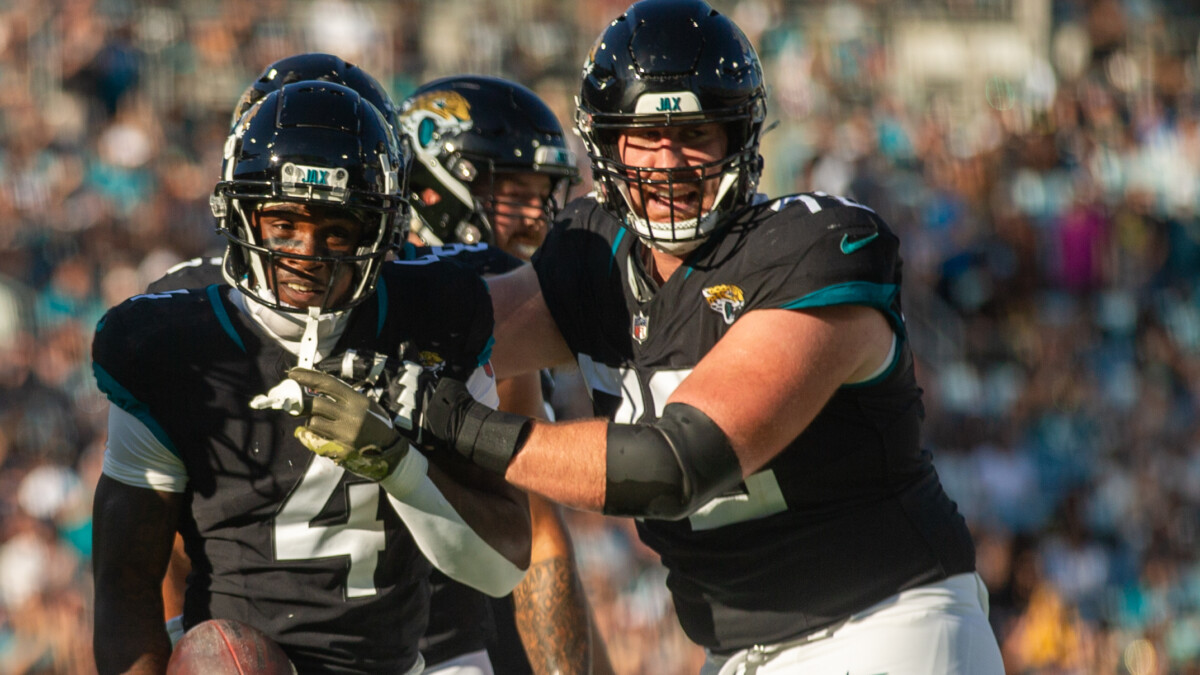 Jacksonville Jaguars offensive guard Walker Little (72) celebrates with running back Tank Bigsby (4) after a first down against the Tennessee Titans on Nov. 19, 2023. | Will Brown, Jacksonville Today