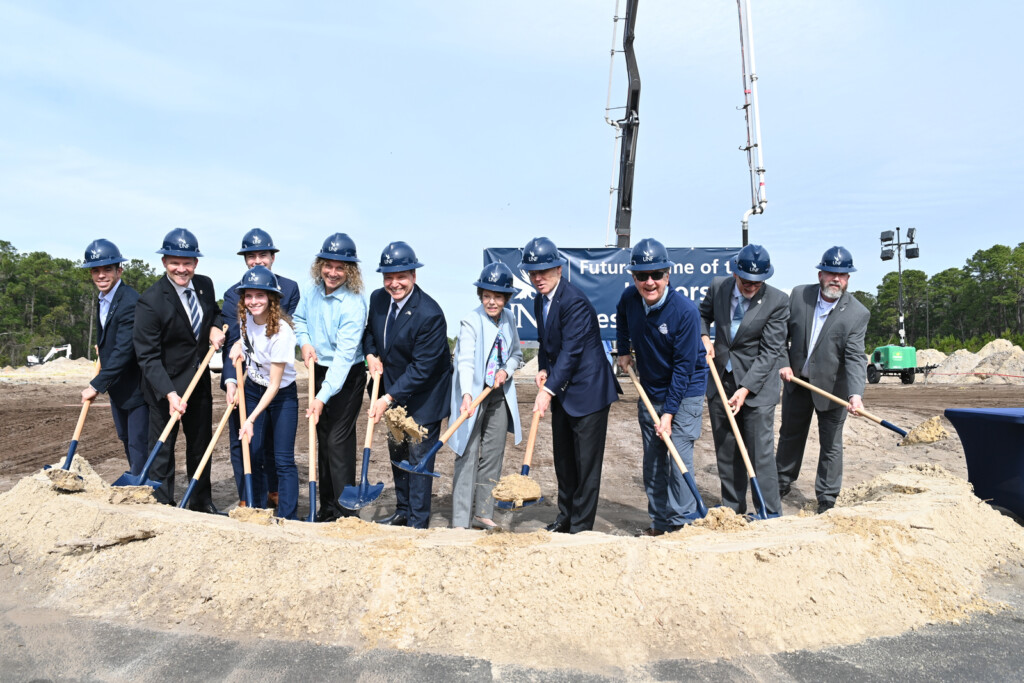 From left to right, Jacksonville City Councilman Raul Arias, Jacksonville City Councilman Will Lahnen, Ann Bordin (front), Johnny Grosso (back), Michael Binder, Moez Limayem, Ann Hicks, Kevin Hyde, Paul McElroy, Jeff Chamberlain and Bob Boyle break ground on a new UNF dorm. | The University of North Florida