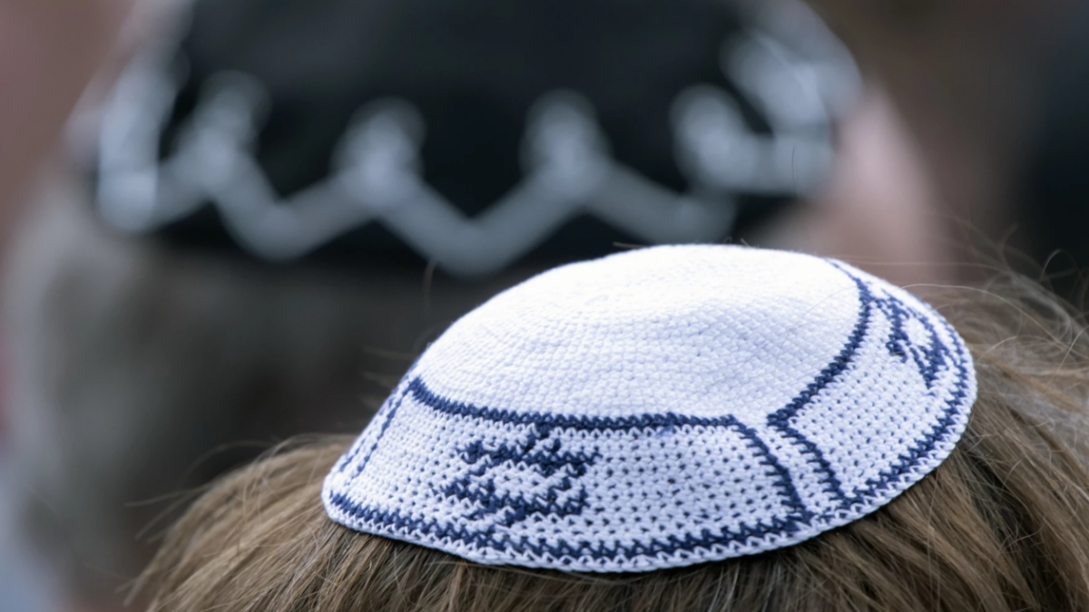 People of different faiths wear the Jewish kippah during a demonstration against anti-Semitism in Germany in April. | Jens Meyer, AP