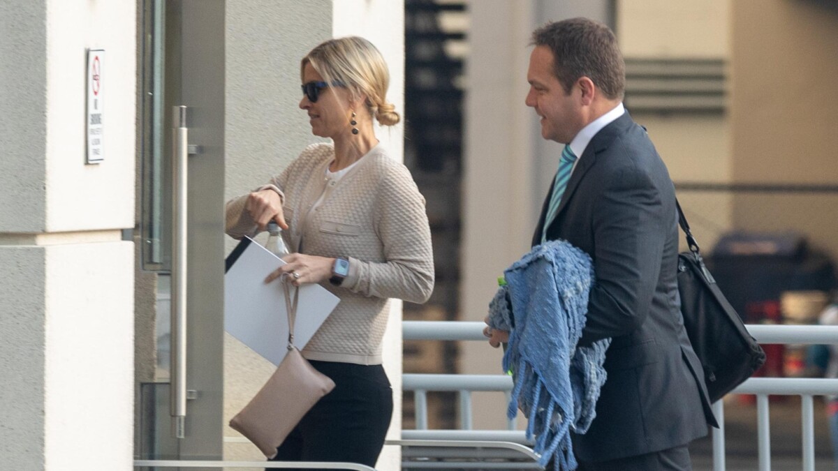 Former JEA CEO Aaron Zahn walks into federal court with his wife, Mary Branan Ennis Zahn, on March 12, 2024. Zahn faces conspiracy and fraud charges from his tenure as CEO of the public utility. | Will Brown, Jacksonville Today