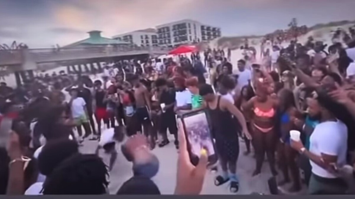 Cellphone video shows large crowds of people on the beach Sunday night near the pier in Jacksonville Beach on March 17, 2024. Two people are seen fighting in the sand. | Jacksonville Beach Police Department