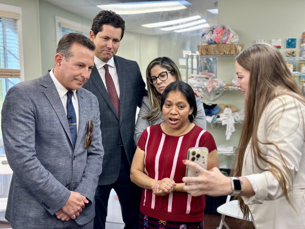 From left, defense attorney Jose Baez, civil attorneys Phillip Arroyo, Josephine Arroyo, a Mam interpreter, and Mari Blanco, assistant director at the Guatemala Maya Center in Lake Worth Beach, give the news to Romeo Aguilar-Lopez, Aguilar-Mendez father. | Wilkine Brutus, WLRN