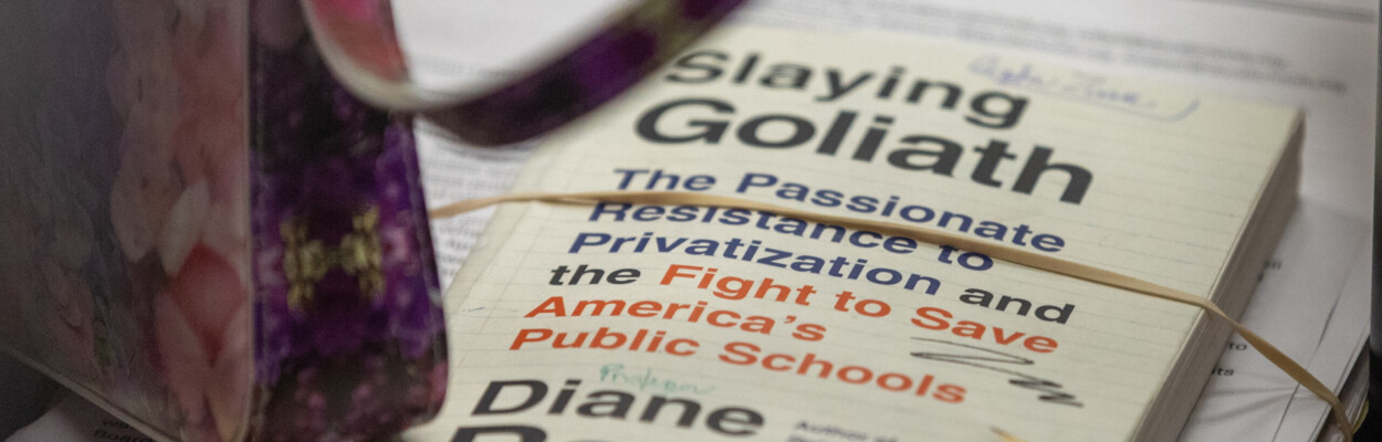 Longtime Atlantic Beach resident Carolyn Zisser brought Diane Ravitch's book "Slaying Goliath" with her to address the Duval County School Board on Tuesday, April 16, 2024. Zisser was among nearly a dozen people who implored the board to keep Atlantic Beach Elementary open. | Will Brown, Jacksonville Today