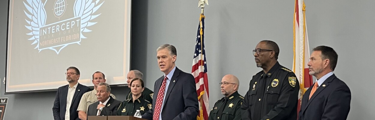 Roger Handberg, U.S. attorney for the Middle District of Florida, discusses the work of the Intercept Task Force during a news conference last week. He is joined by Northeast Florida sheriffs, nonprofit partners and Florida Rep. Sam Garrison. | Noah Hertz, Jacksonville Today.