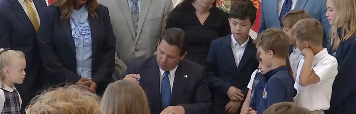 Gov. Ron DeSantis signs a wide-ranging education bill Tuesday, April 16, 2024, at the Jacksonville Classical Academy. | News4Jax