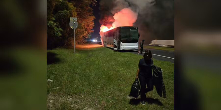Passengers flee a bus that caught fire Friday, April 19, 2024, as St. Johns County residents traveled to Tallahassee. | Photo provided to News4Jax.