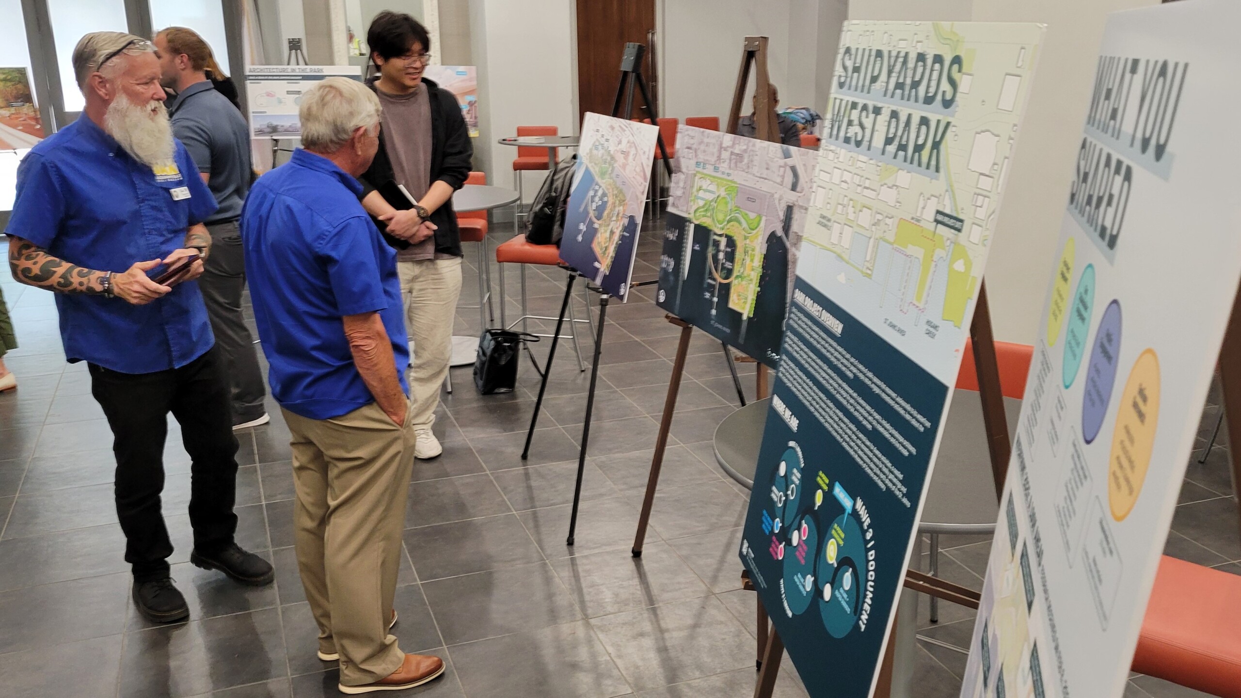 Senior volunteers from the USS Orleck maritime museum, on the west side of the planned Shipyards West Park, look at design drawings for the site. | Dan Scanlan, Jacksonville Today