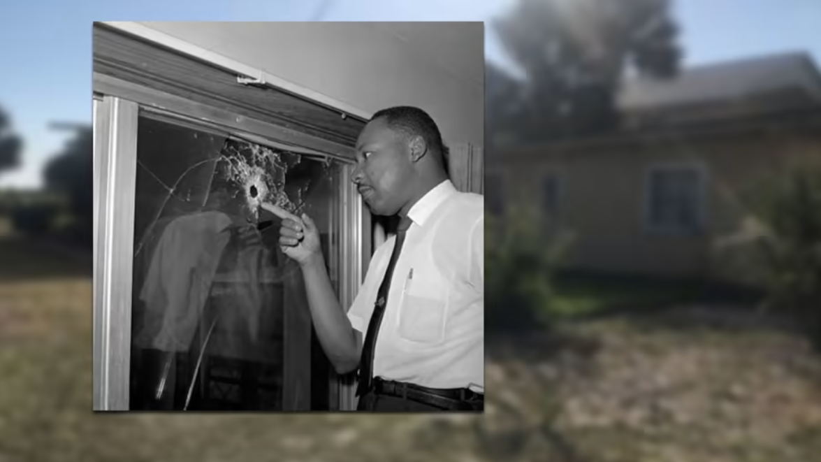 The Rev. Martin Luther King Jr. points to a bullet hole in a St. Johns County home in 1964. | Florida archives, News4Jax