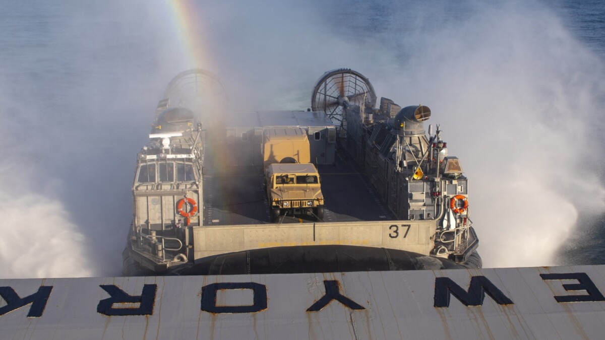 An air-cushioned landing craft prepares to enter the well deck of the amphibious transport dock ship USS New York in the Atlantic Ocean. l Navy Petty Officer 2nd Class Lyle Wilkie, US Navy.