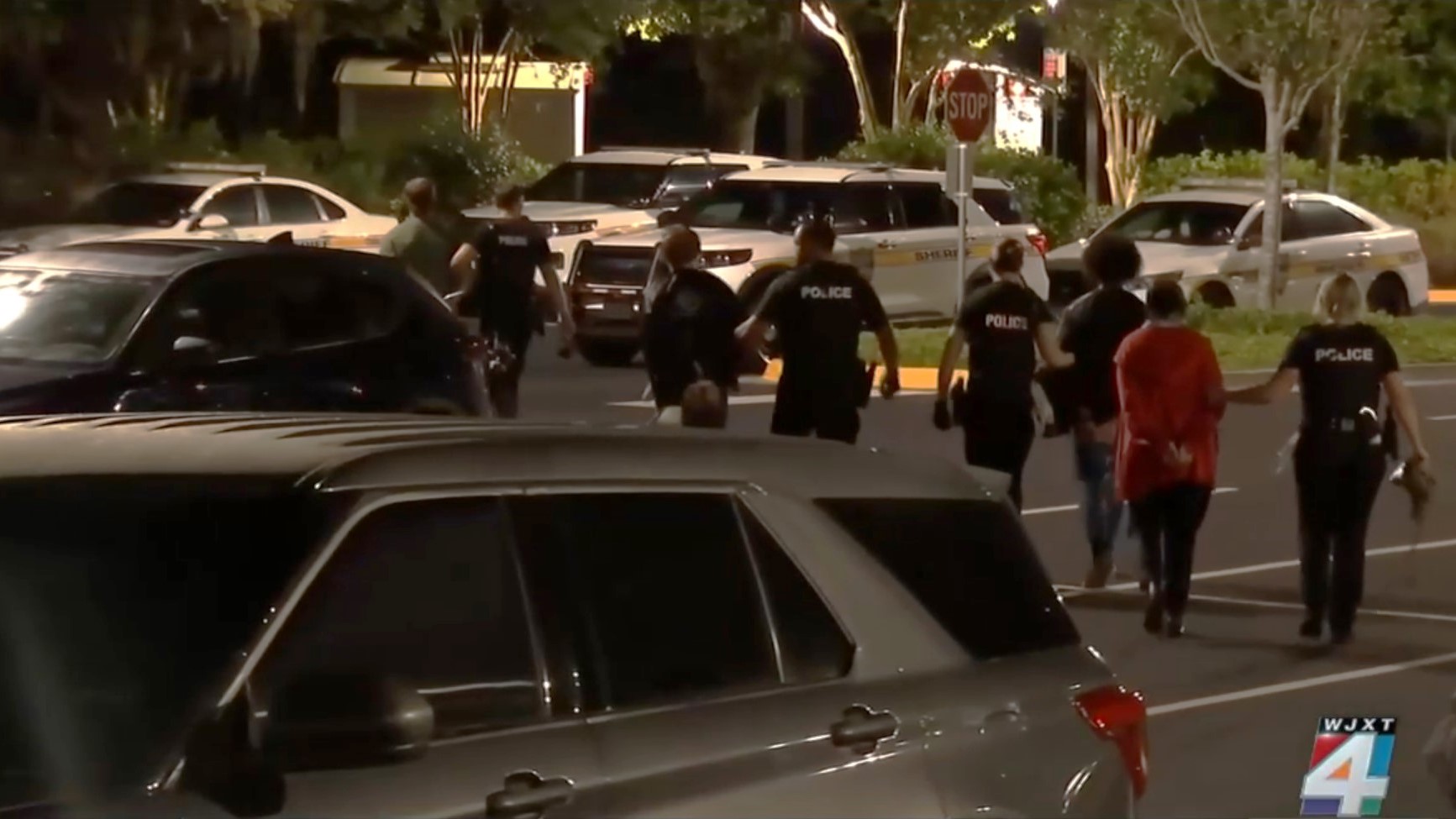 Jacksonville police officers lead away some of the 16 people arrested Thursday, May 2, 2024, during a pro-Palestine protest at the University of North Florida. | News4Jax