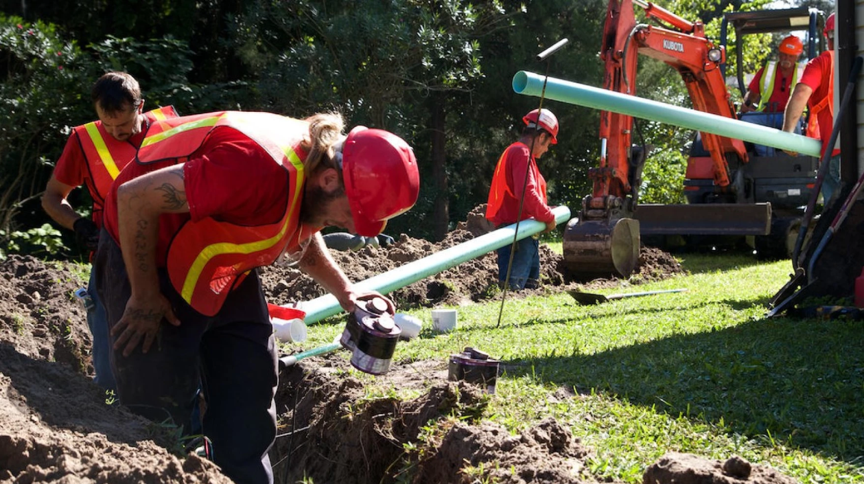 JEA workers connect a home to a sewer line in 2014. | Peter Haden, Jacksonville Today