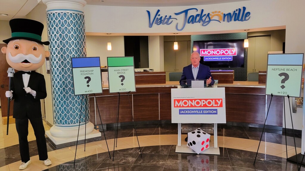 Visit Jacksonville CEO Michael Corrigan announces the new Jacksonville edition of Monopoly on Thursday, June 13, 2024. The game's iconic character, Milburn Pennybags, stands to the side. | Dan Scanlan, Jacksonville Today