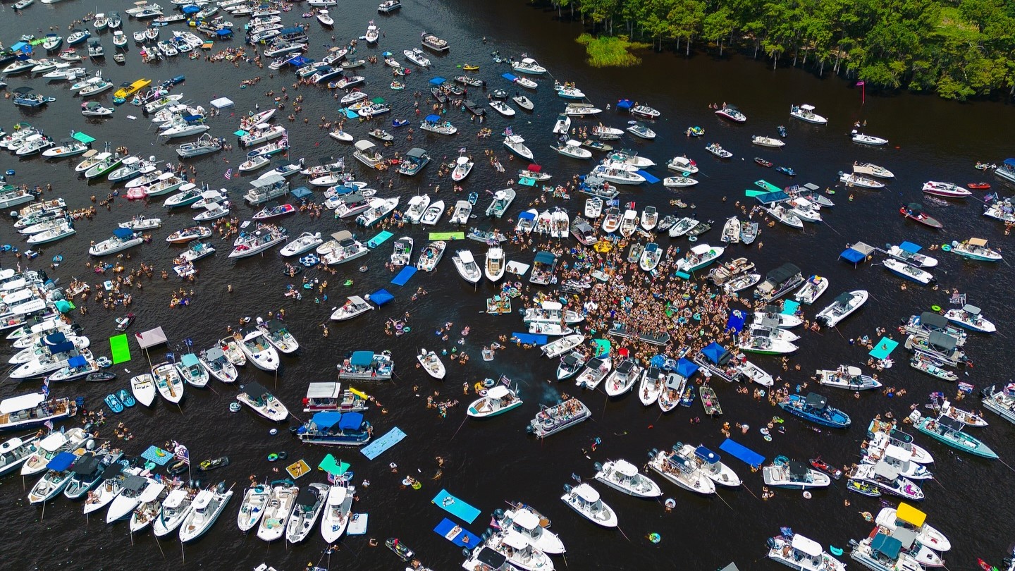 Boats cram Bayard Point during Clay County’s unofficial Boater Skip Day last year | 904 Happy Hour